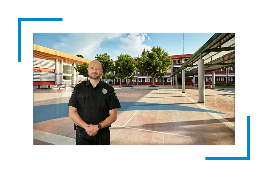 Allied Universal Security guard in uniform in a school